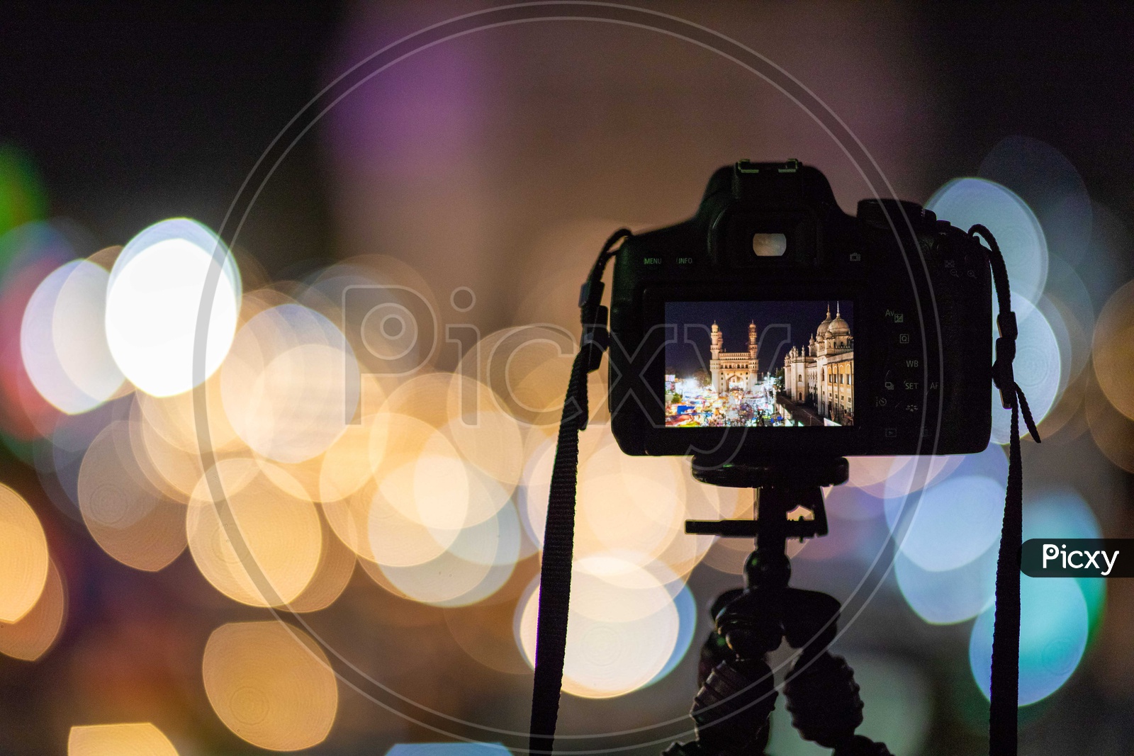 Camera mounted to tripod shooting night lights of Charminar