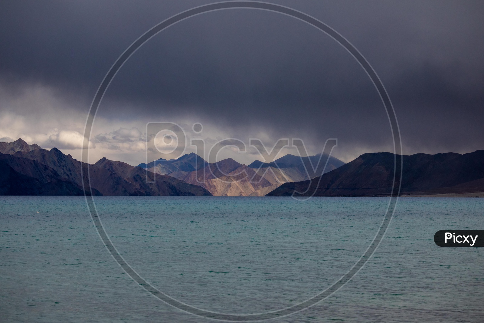 Landscape of Pangong Lake along with the snow capped mountains