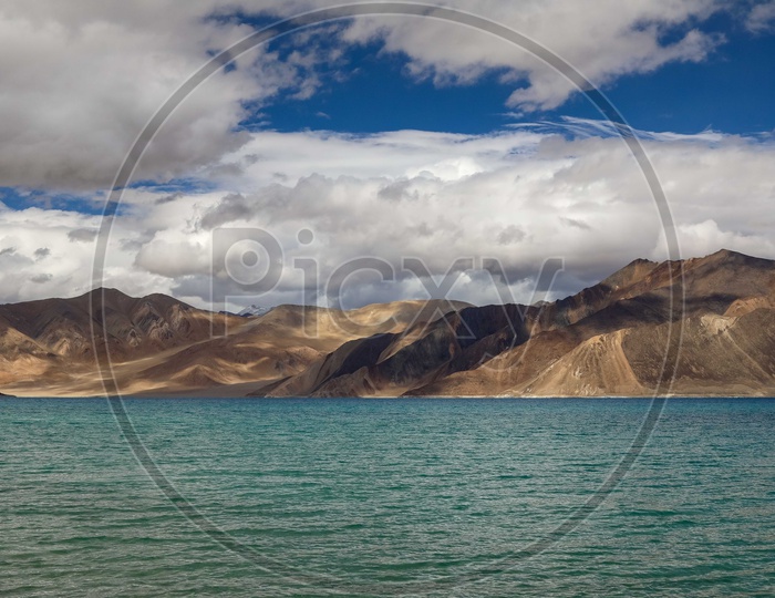 Landscape of mountains by the Indus river covered with clouds