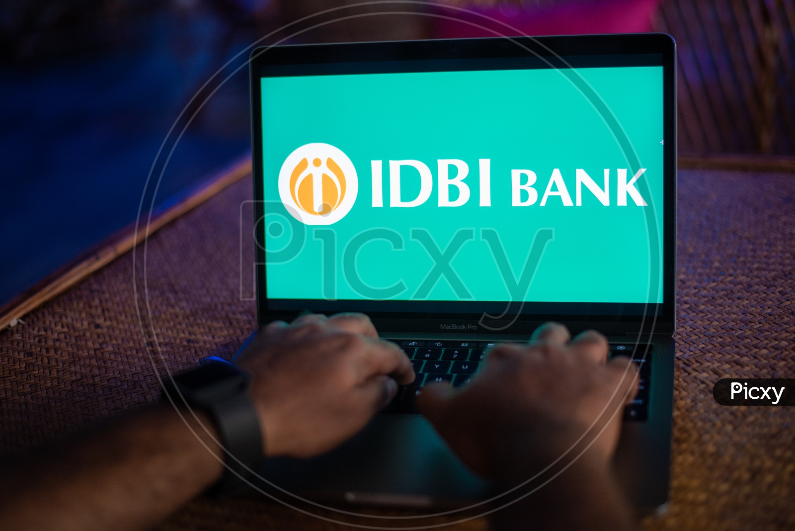 Indian Man Accessing IDBI BANK Portal In Laptop