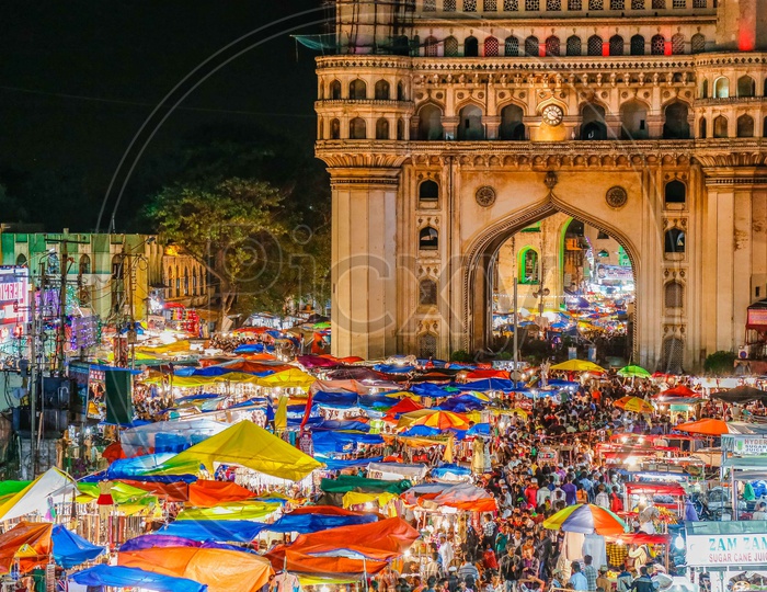 Crowd in the street bazaar during the night by the Charminar