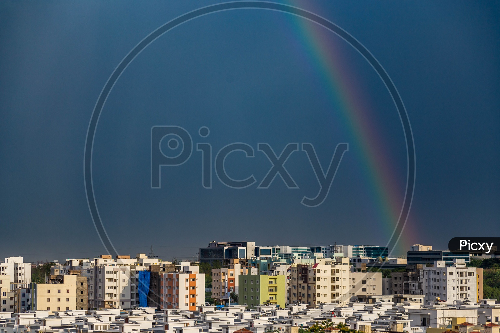 Rainbow  over Hyderabad City Scape With High Rise Buildings