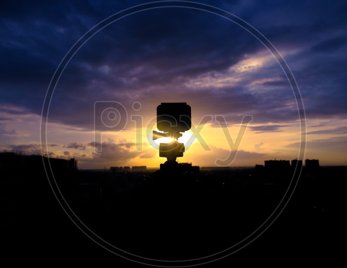 Silhouette of a Gopro Action Camera  Mounted to a  Tripod