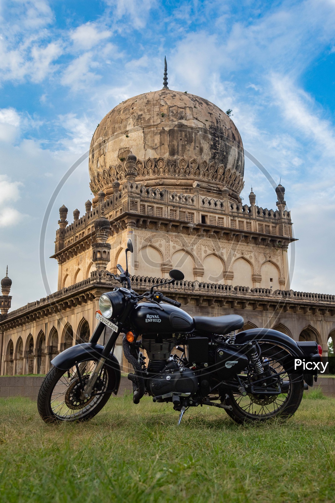 Royal Enfield Bike in front of Qutb Shahi Tombs