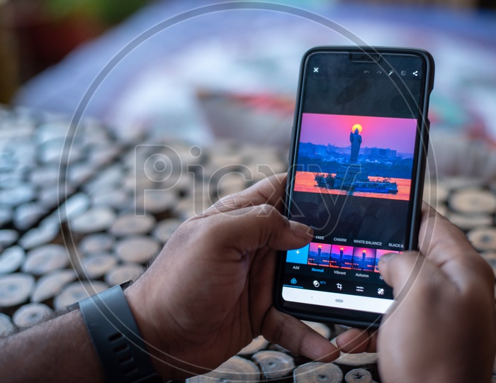 Indian Man Using Instagram in Smart Phone
