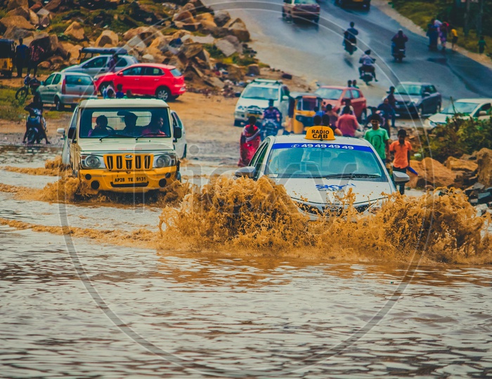 Cars Driving through flood water