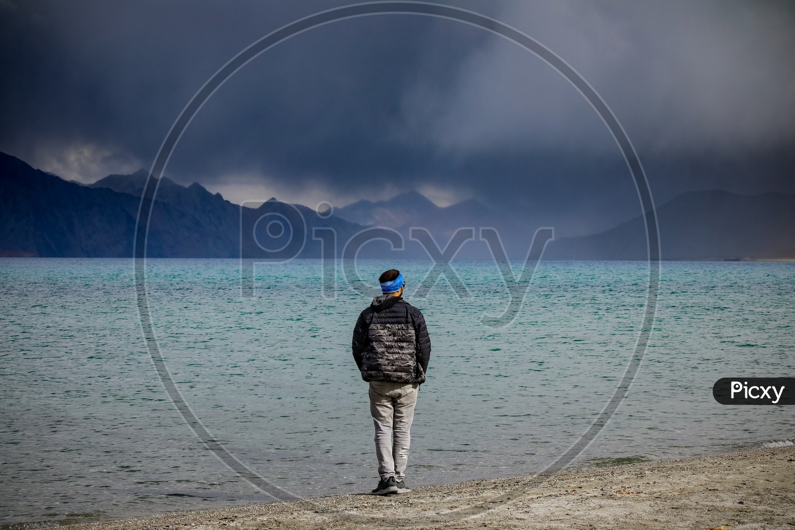 Man standing by the Pangong Lake