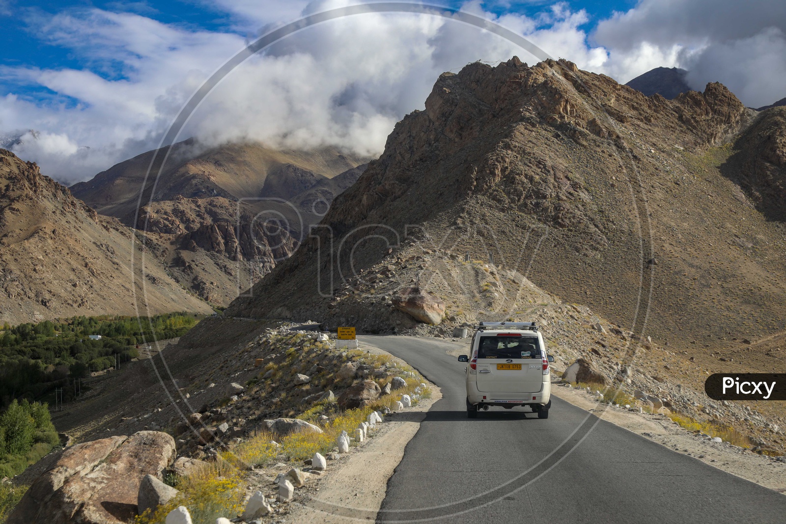 Moving cab on the roadway by the mountain