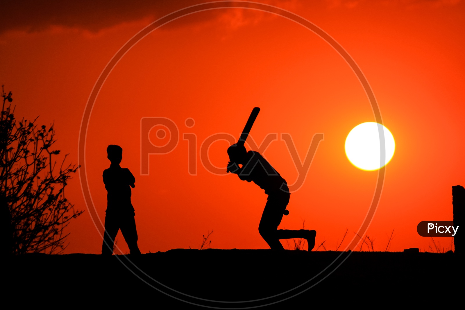 Street Kids Playing Cricket and Sunset in Background