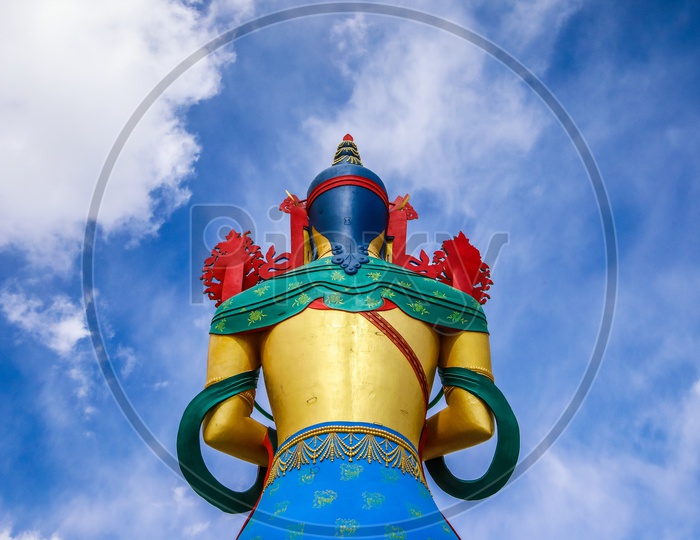 Rear view of the Giant Maitreya Statue with blue sky