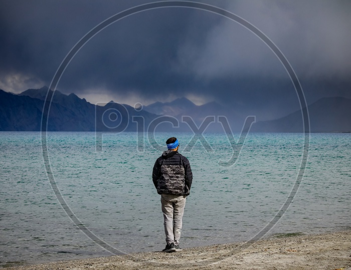 Man standing by the Pangong Lake