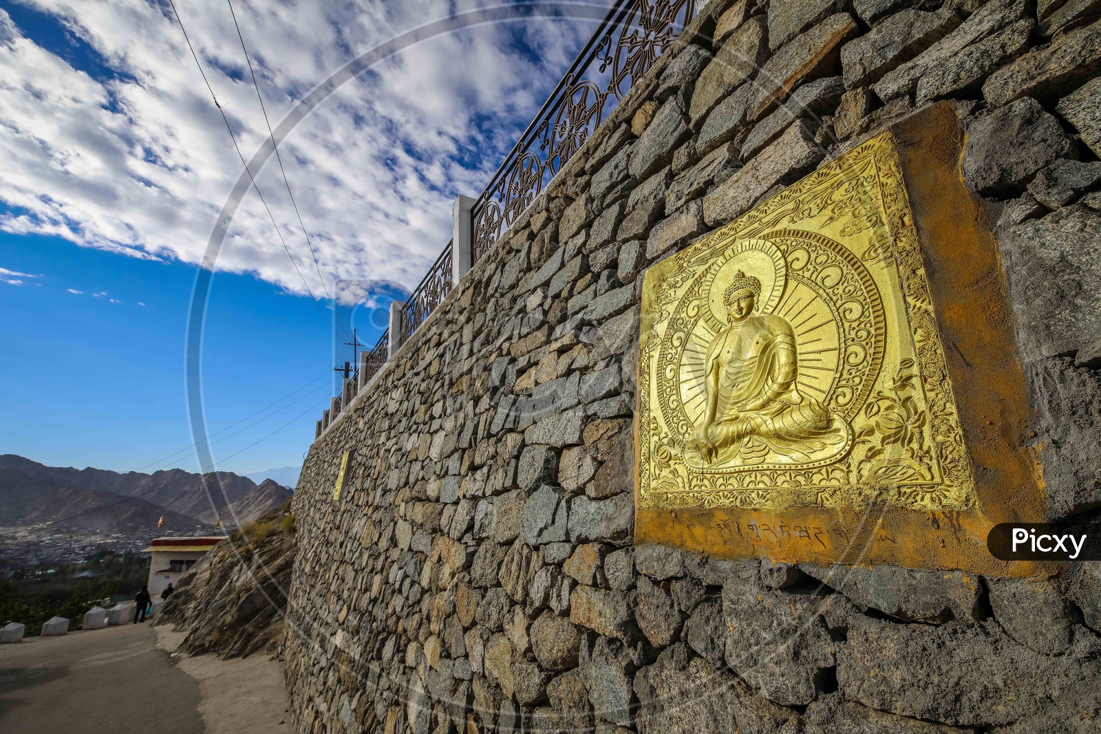 Lord Buddha engravement on the rock wall