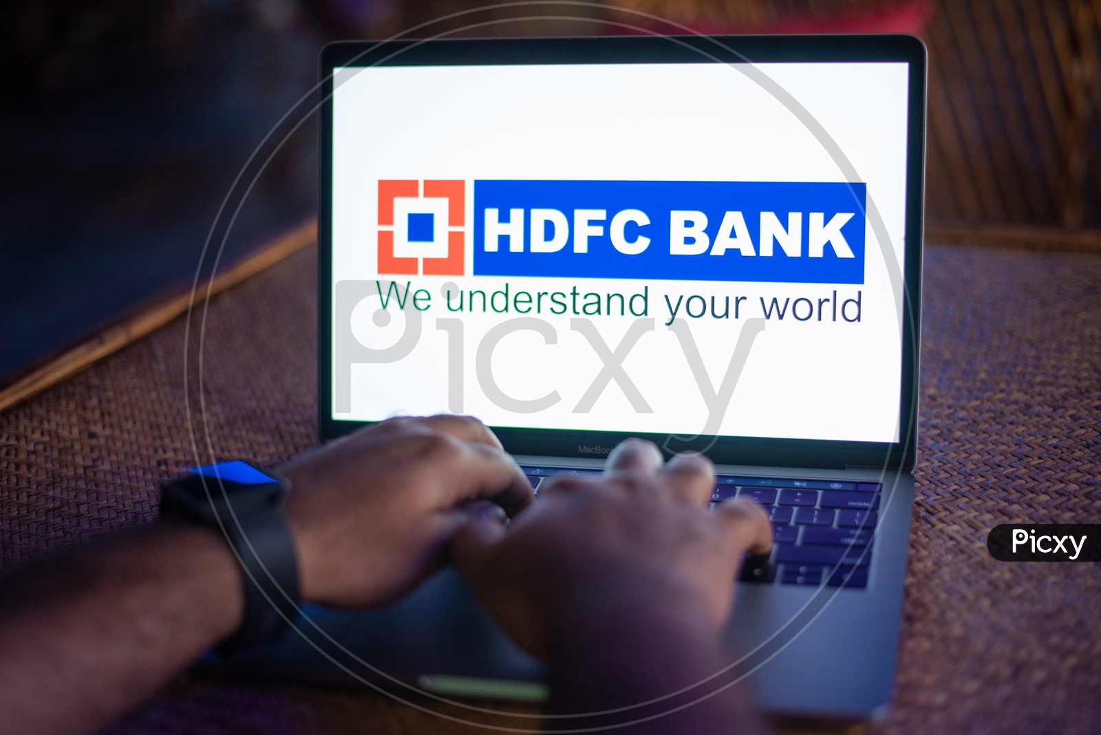 Indian Youth Accessing Online Banking Of  HDFC  BANK  in Laptop