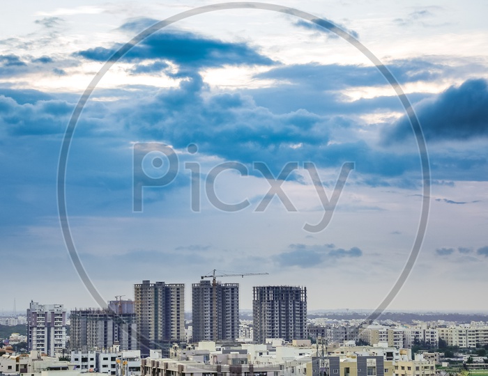 Hyderabad City Scape With High Rise Construction Buildings With Dark Clouds in Sky