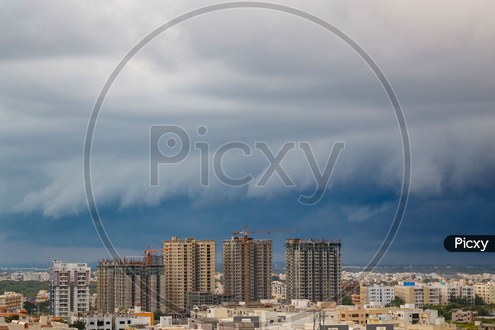 Hyderabad City Scape With High Rise Construction Buildings And Apartments over  a Bluse Sky with Cotton Clouds