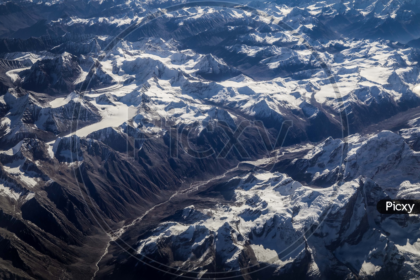 Snow-capped mountains of leh captured from flight window