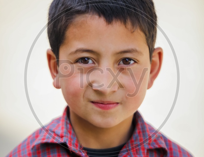 Portrait of Unidentified boy child by the mountains