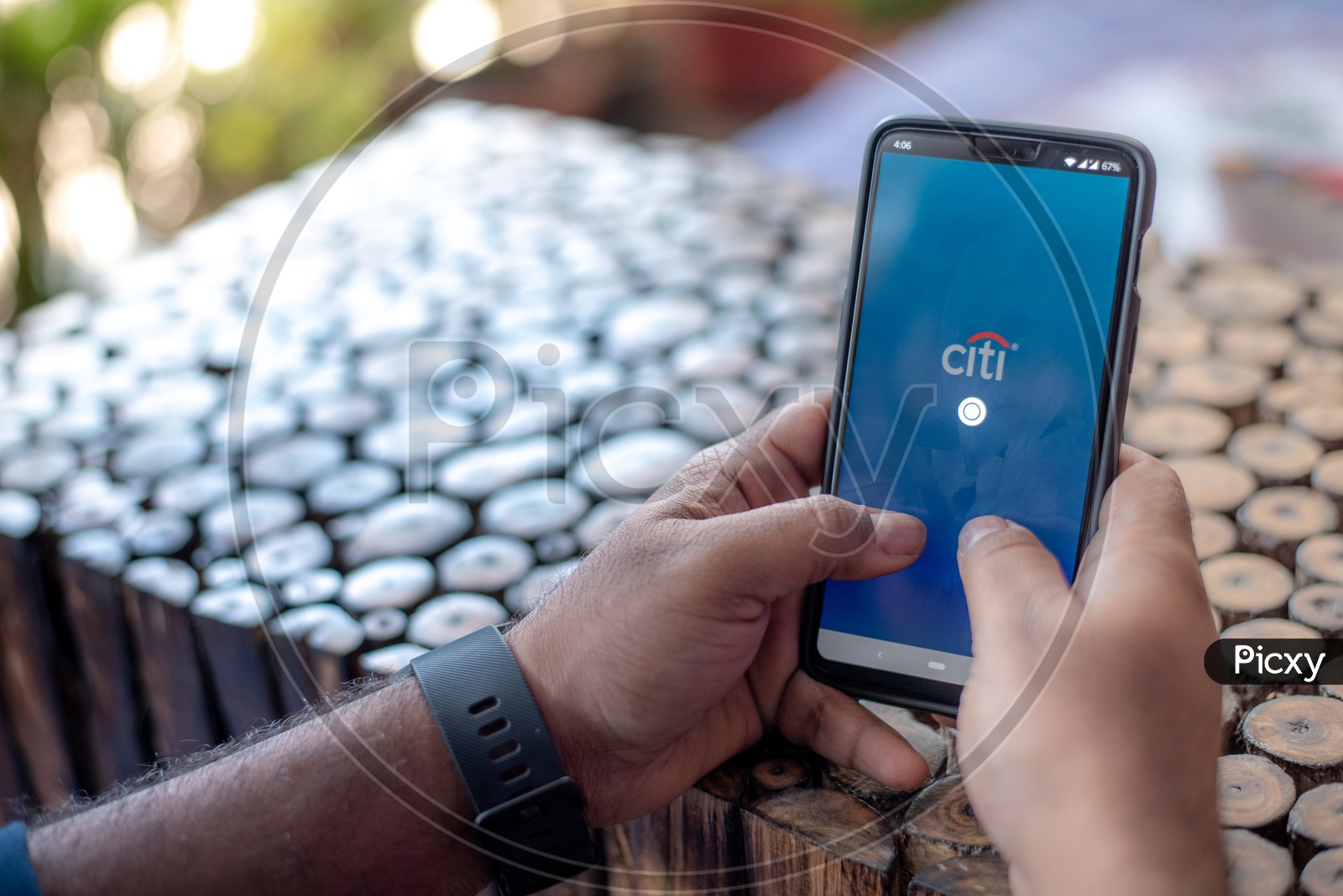 Indian Man Accessing Citi Bank App in Smart Phone