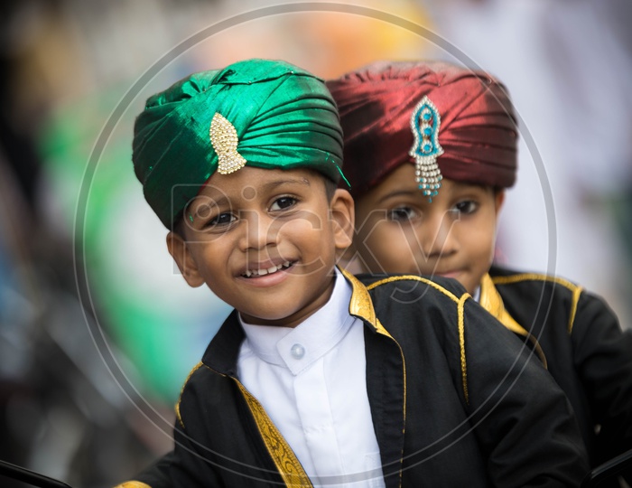 Portrait of two muslim kids wearing fancy turbans. Ramadan Celebrations.