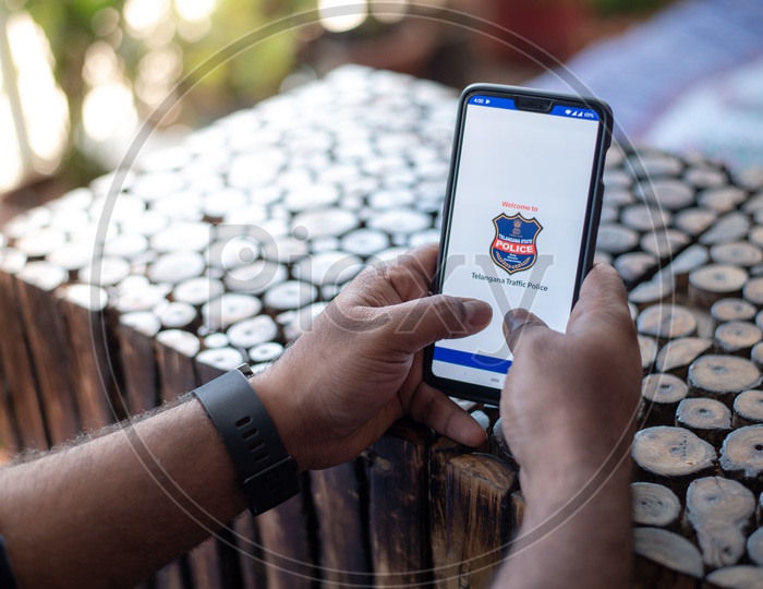 Indian Man Accessing Telangana State Police E-Challan Portal In Smart Phone