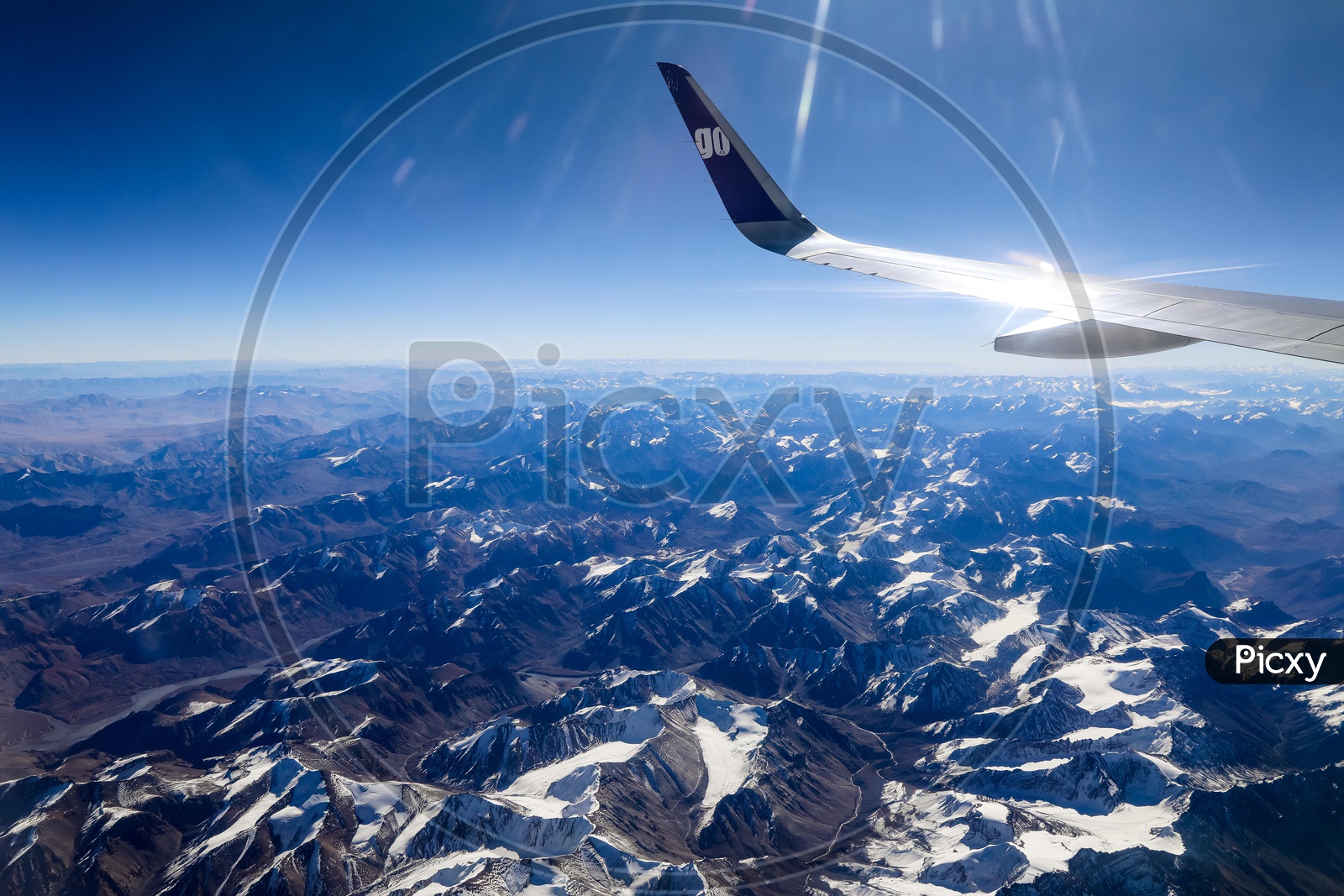 Snow-capped mountains of leh captured from flight window