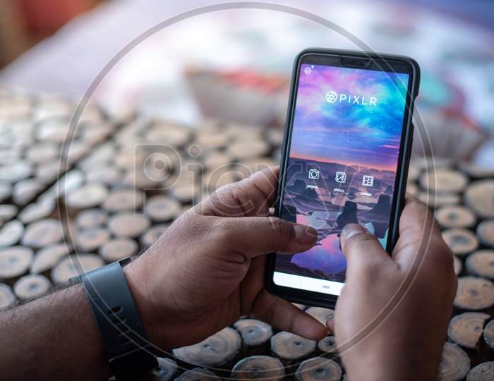 Indian Man Using PIXLR App in Smart Phone