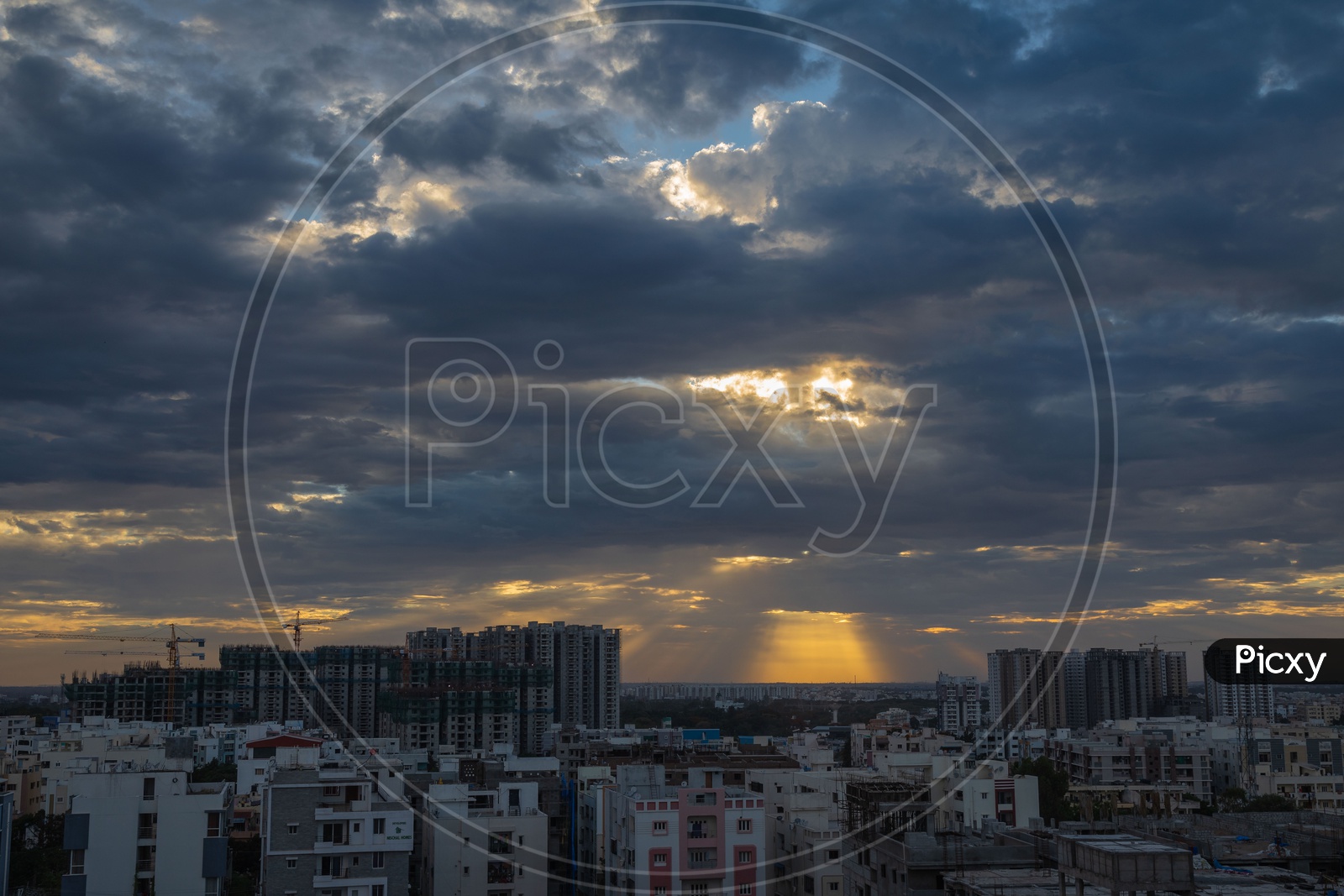 City Scape View With High Rise Buildings on a Cloudy Day With Dark Clouds In Sky