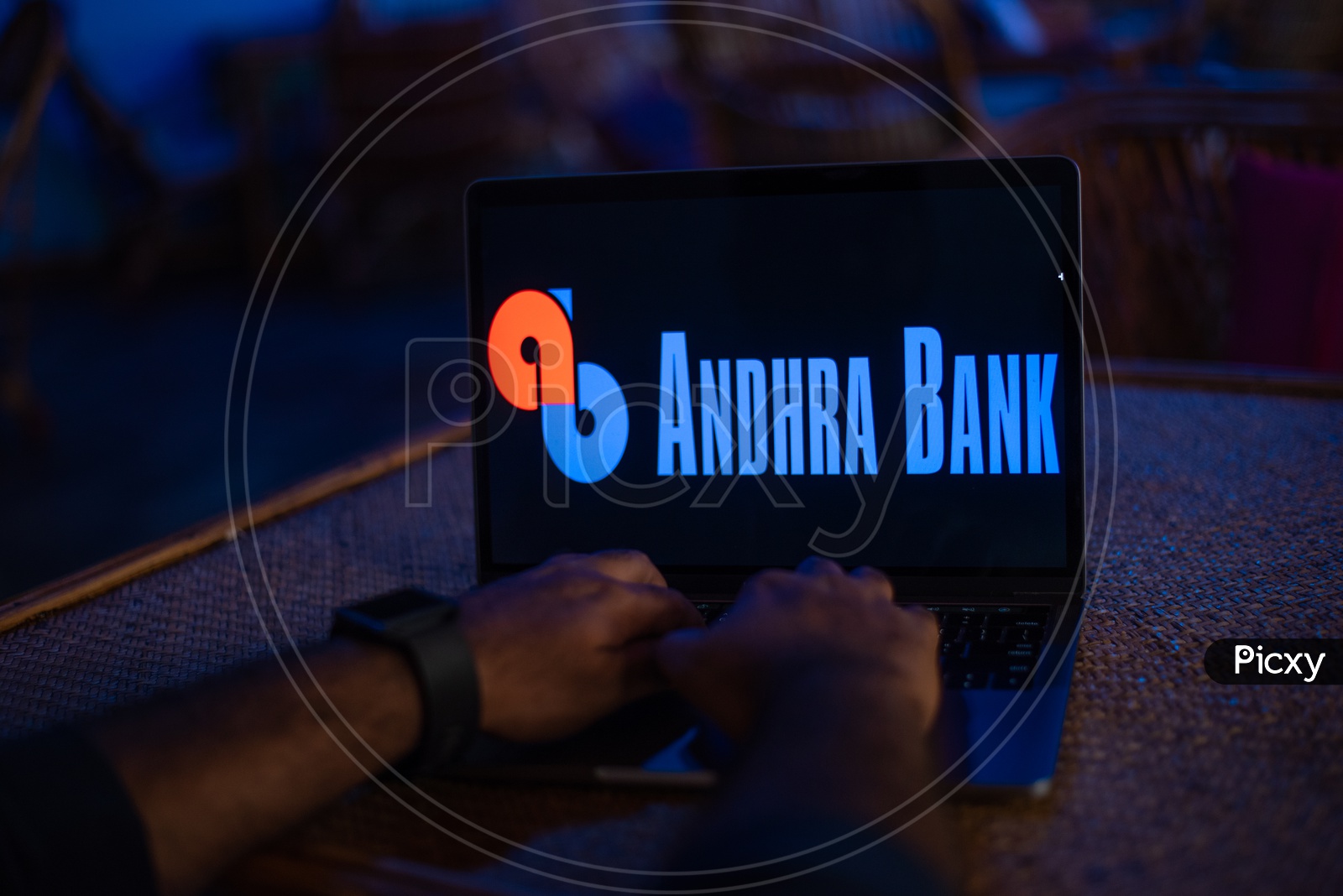 Indian Youth Accessing Online Banking Of Andhra  BANK  in Laptop