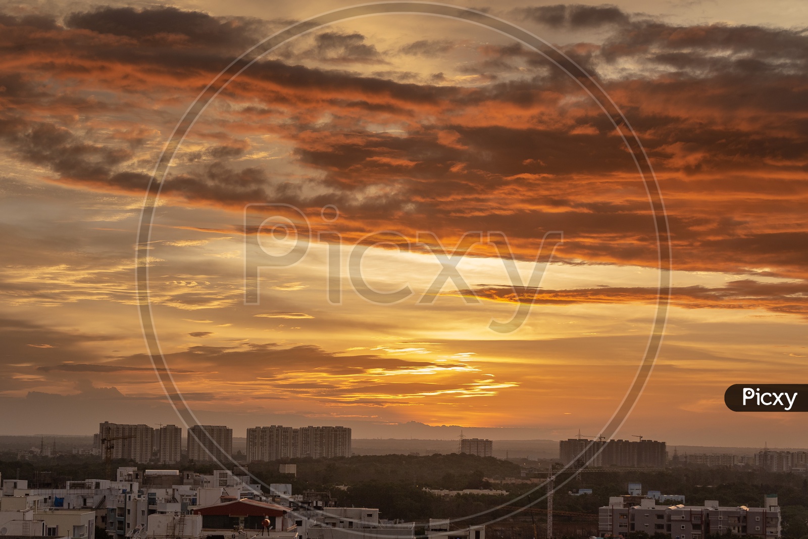 Hyderabad - Sunset Over City Scape With Dark Clouds In Sky