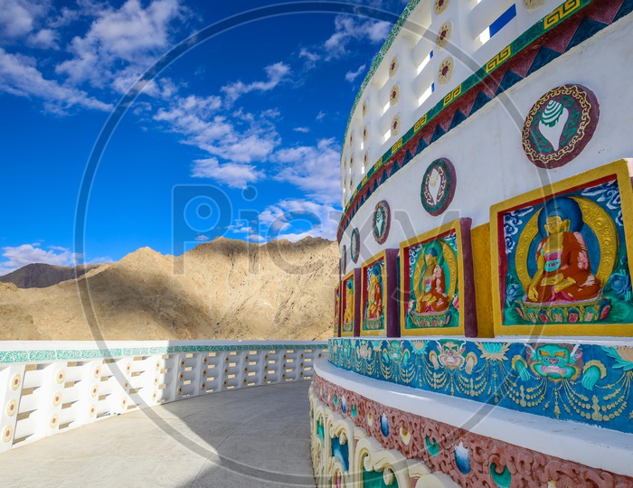 Architecture of Shanti Stupa alongside the hills