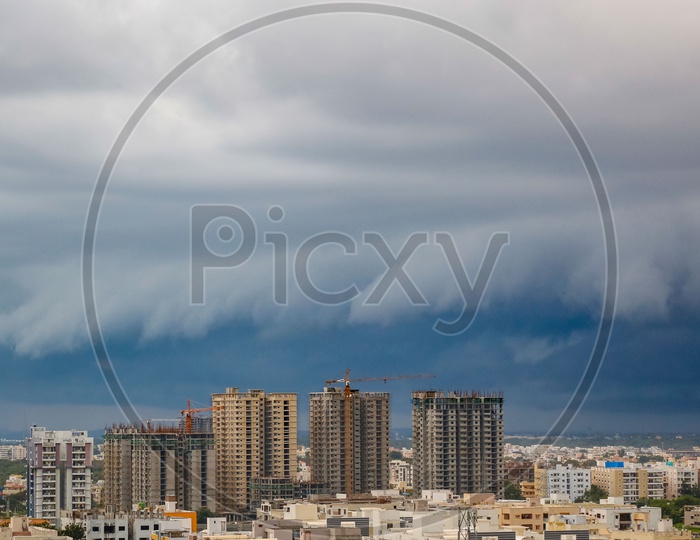 Hyderabad City Scape With High Rise Construction Buildings And Apartments over  a Bluse Sky with Cotton Clouds