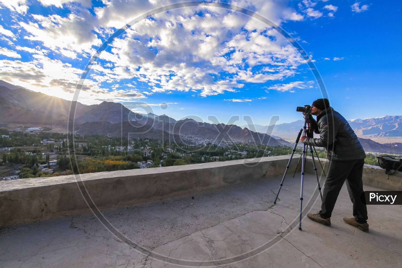 Man shooting the Landscape of the hills during sunrise
