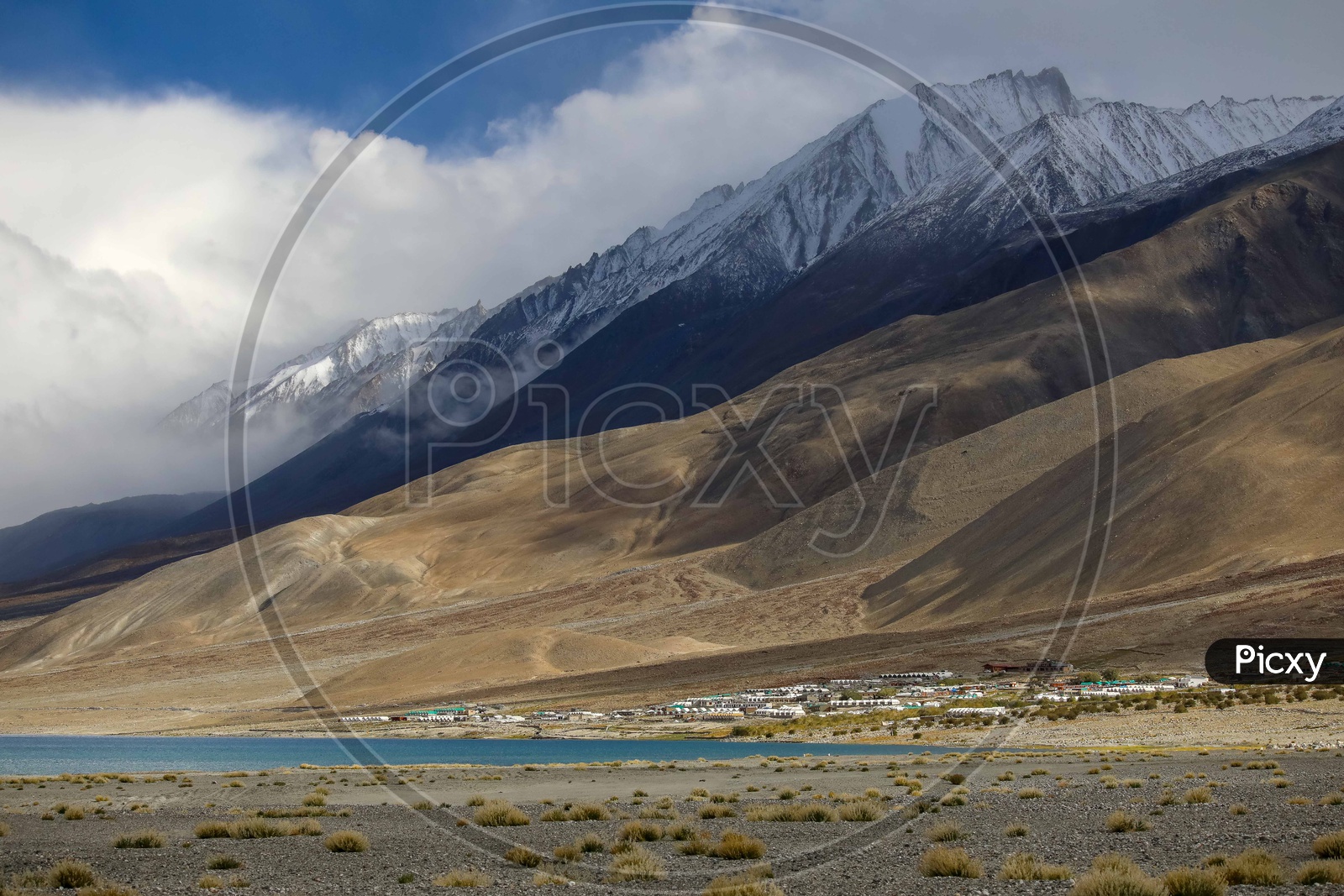 Landscape of snow capped mountains amidst of Pangong Lake