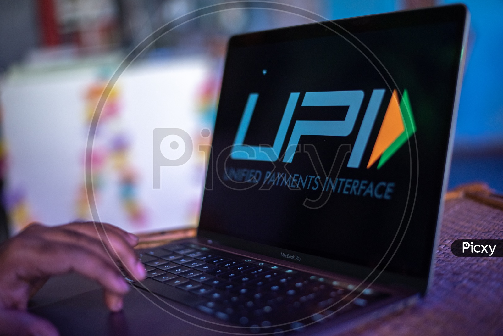 Indian Youth Accessing Unified Payment Interface ( UPI )  in Laptop