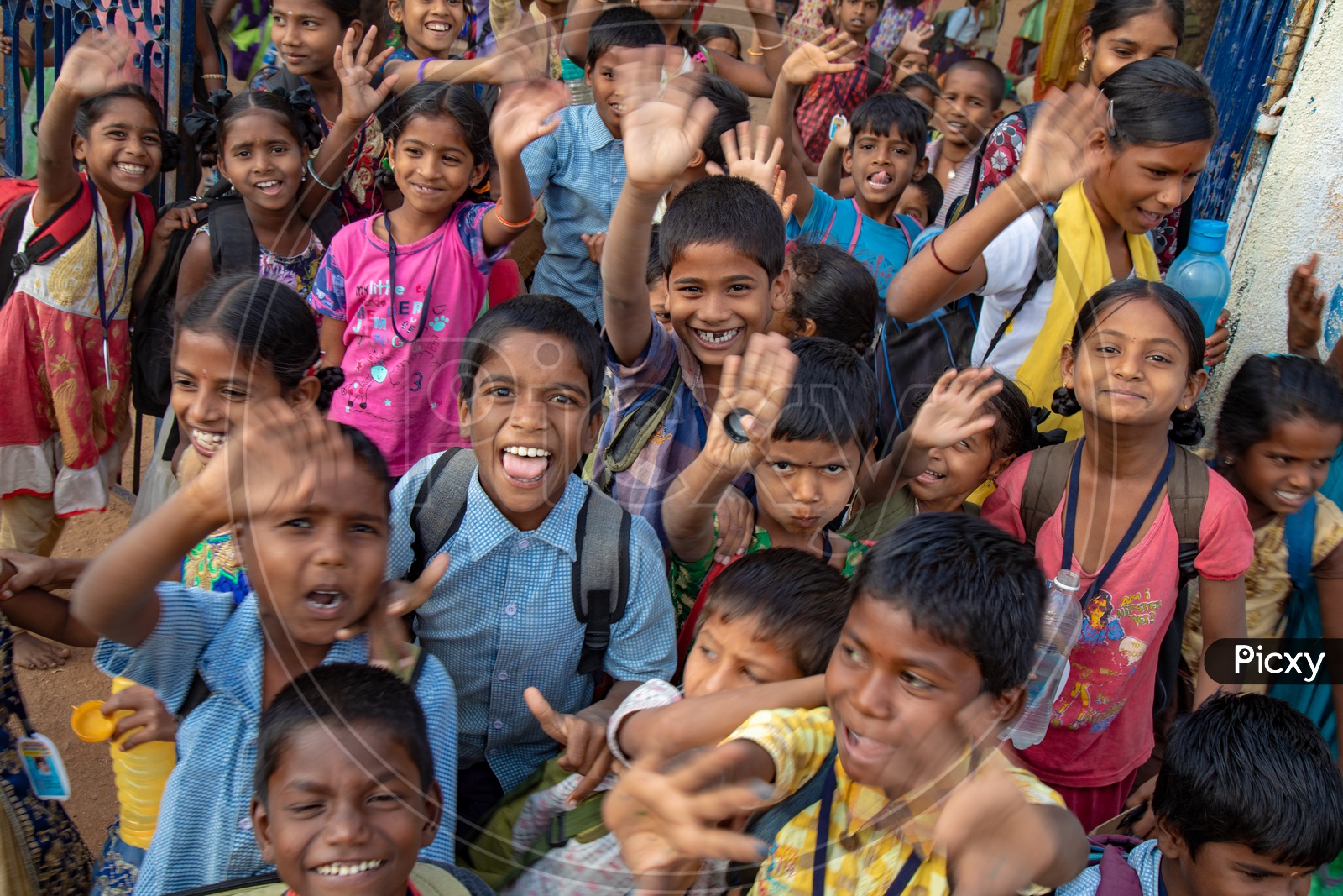 Indian School Children Happily Smiling And Waving