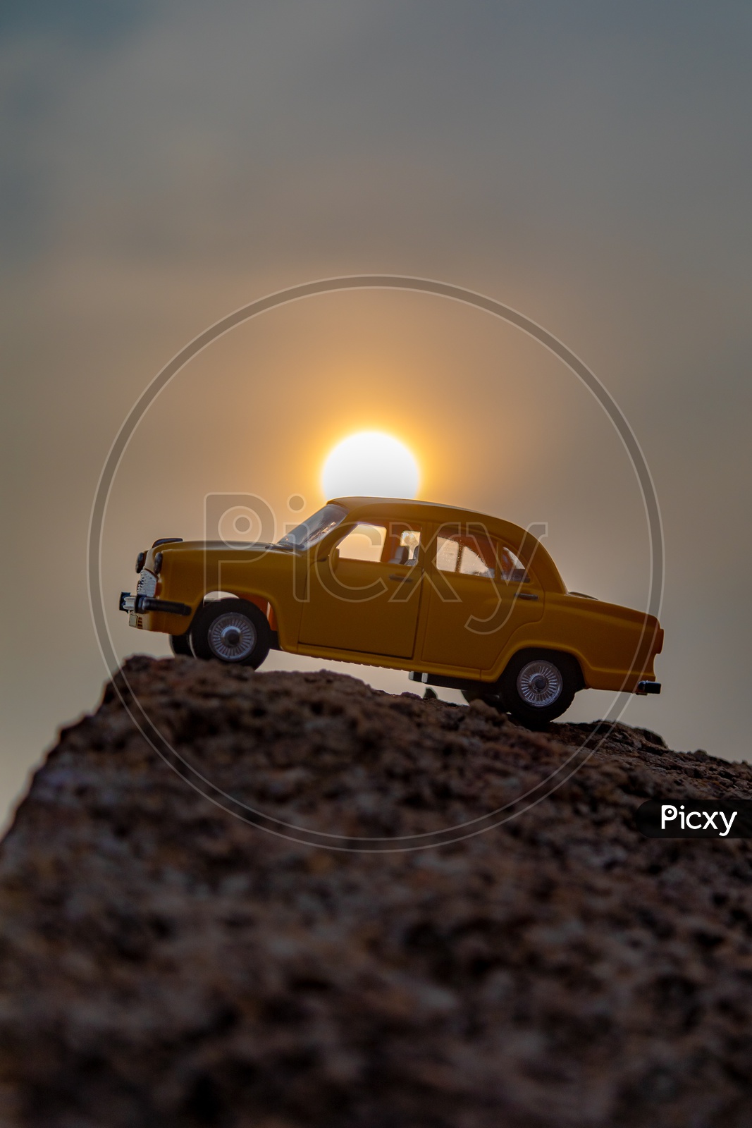 Toy Ambassador Car and Sunset in Background