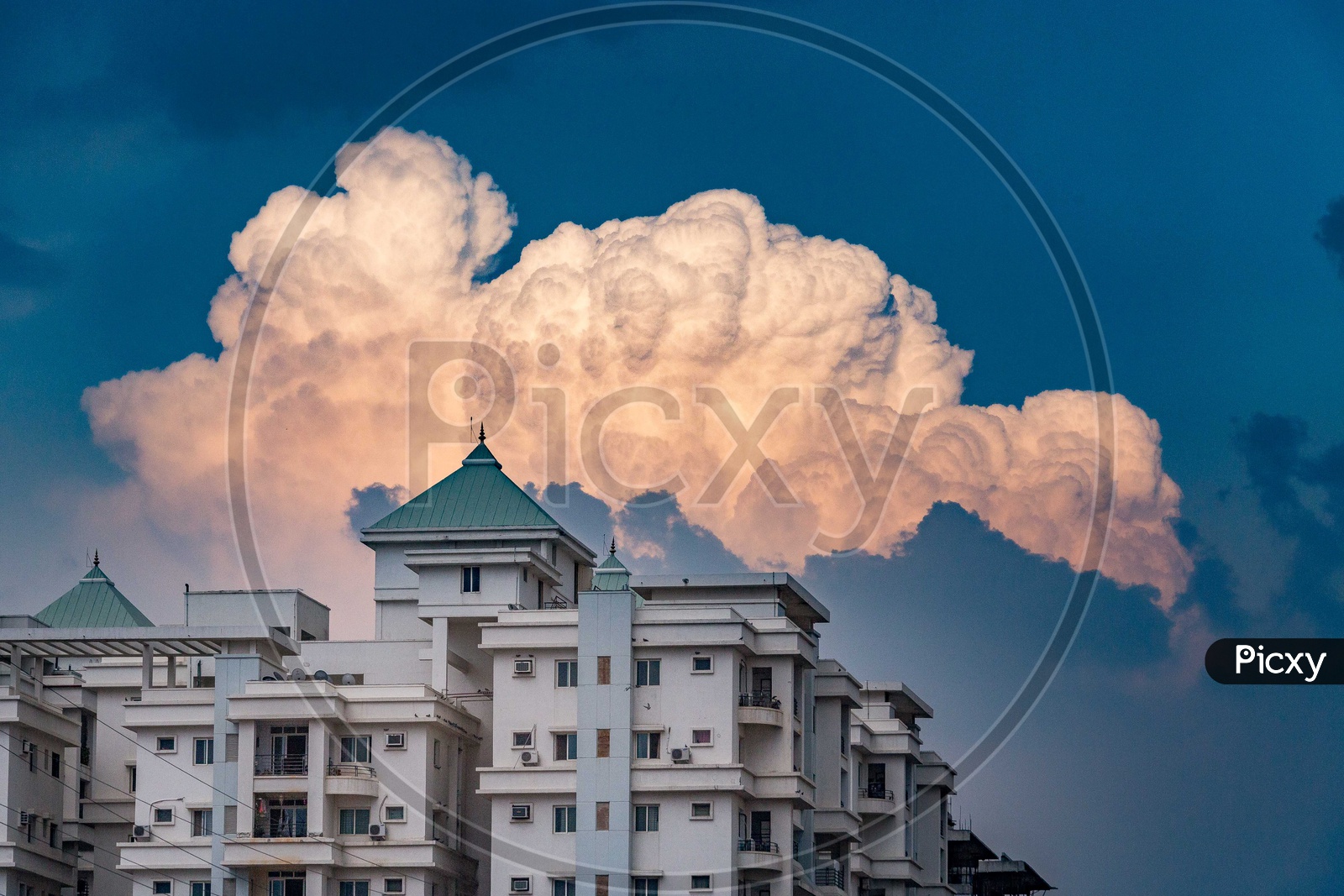 High Rise Buildings With Cotton Clouds in BlueSky Background