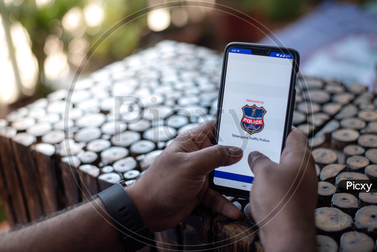 Indian Man Accessing Telangana State Police E-Challan Portal In Smart Phone