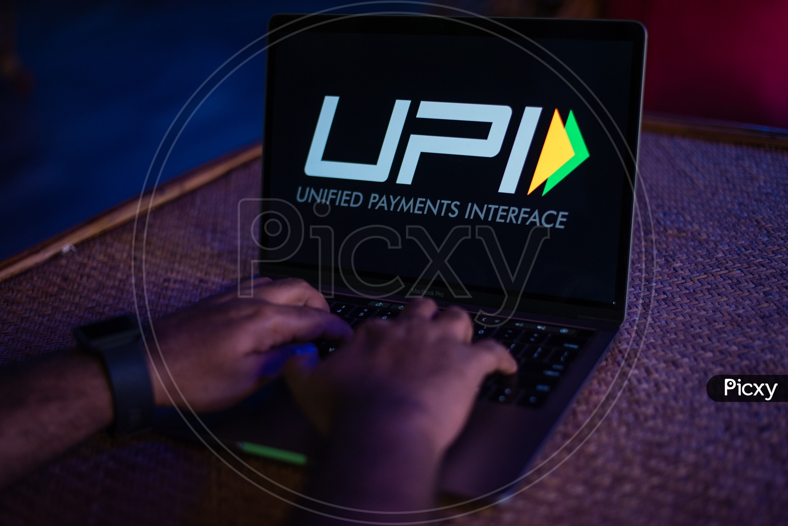 Indian Youth Accessing Unified Payment Interface ( UPI )  in Laptop