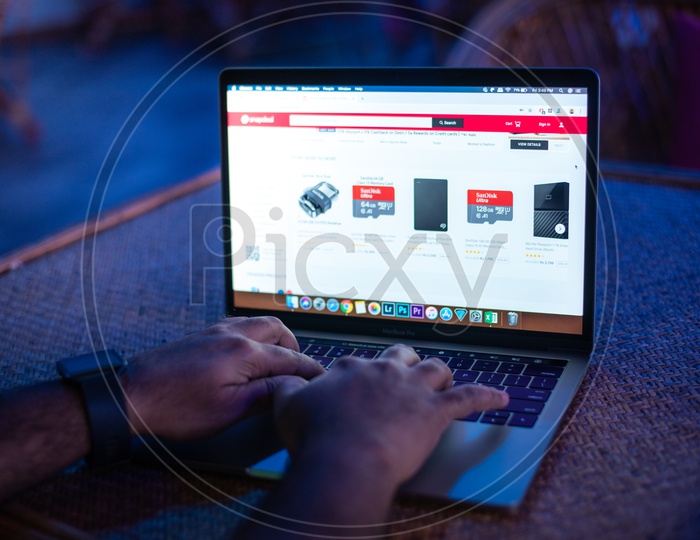 Indian Man Browsing Snapdeal For Electronics In Online In Laptop