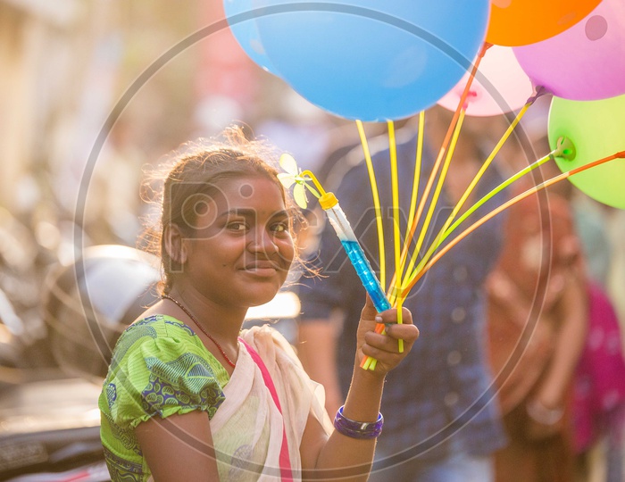Portrait of an Indian Young Girl Selling Balloons In Streets