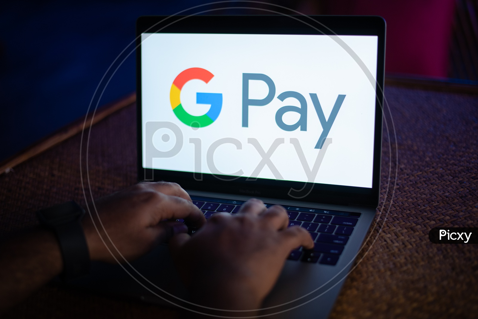 Indian Youth Accessing Google Pay ( G Pay )   in Laptop