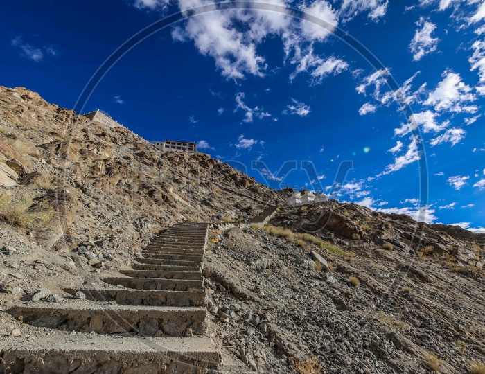 Stairway made of rocks alongside a monastery