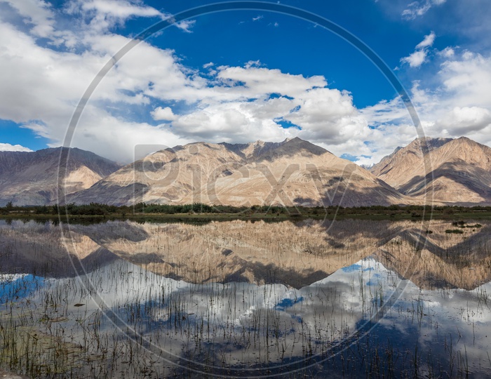 Reflection of landscape of mountains