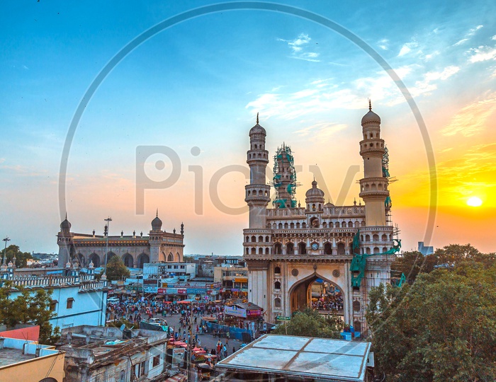 Landscape of Charminar alongside the Mecca Masjid during sunrise