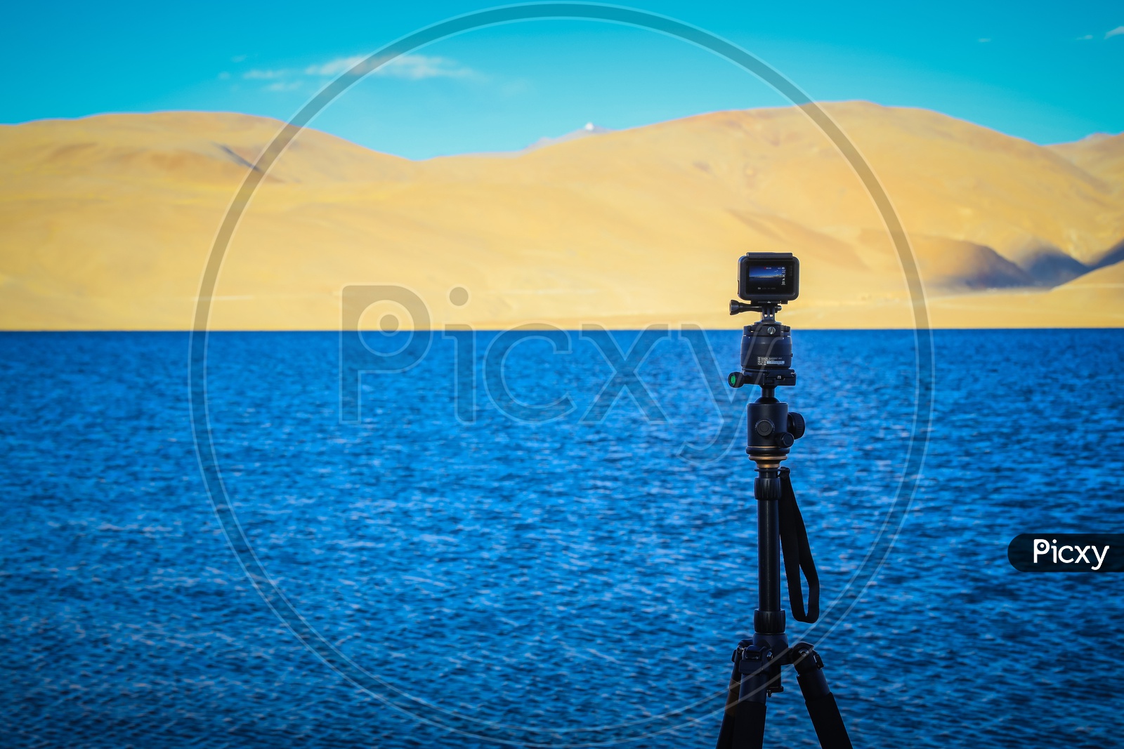 GoPro mounted to a tripod alongside the Pangong lake