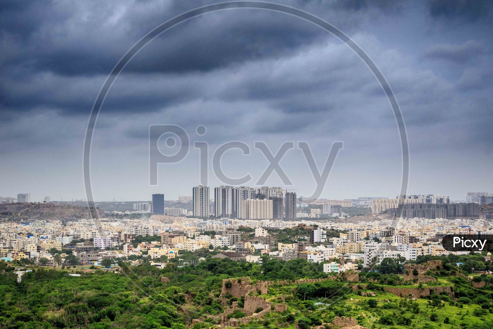 Hyderabad City Scape With High Rise Buildings on a Cloudy Day With Thick Dark Clouds in Sky