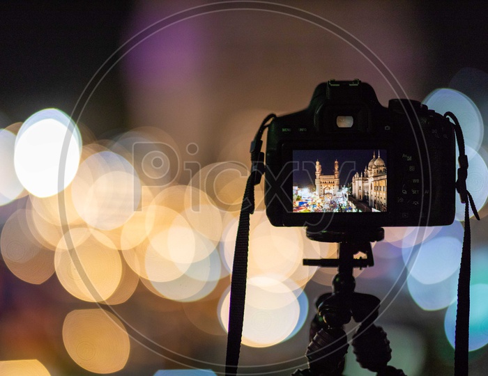 Camera mounted to tripod shooting night lights of Charminar
