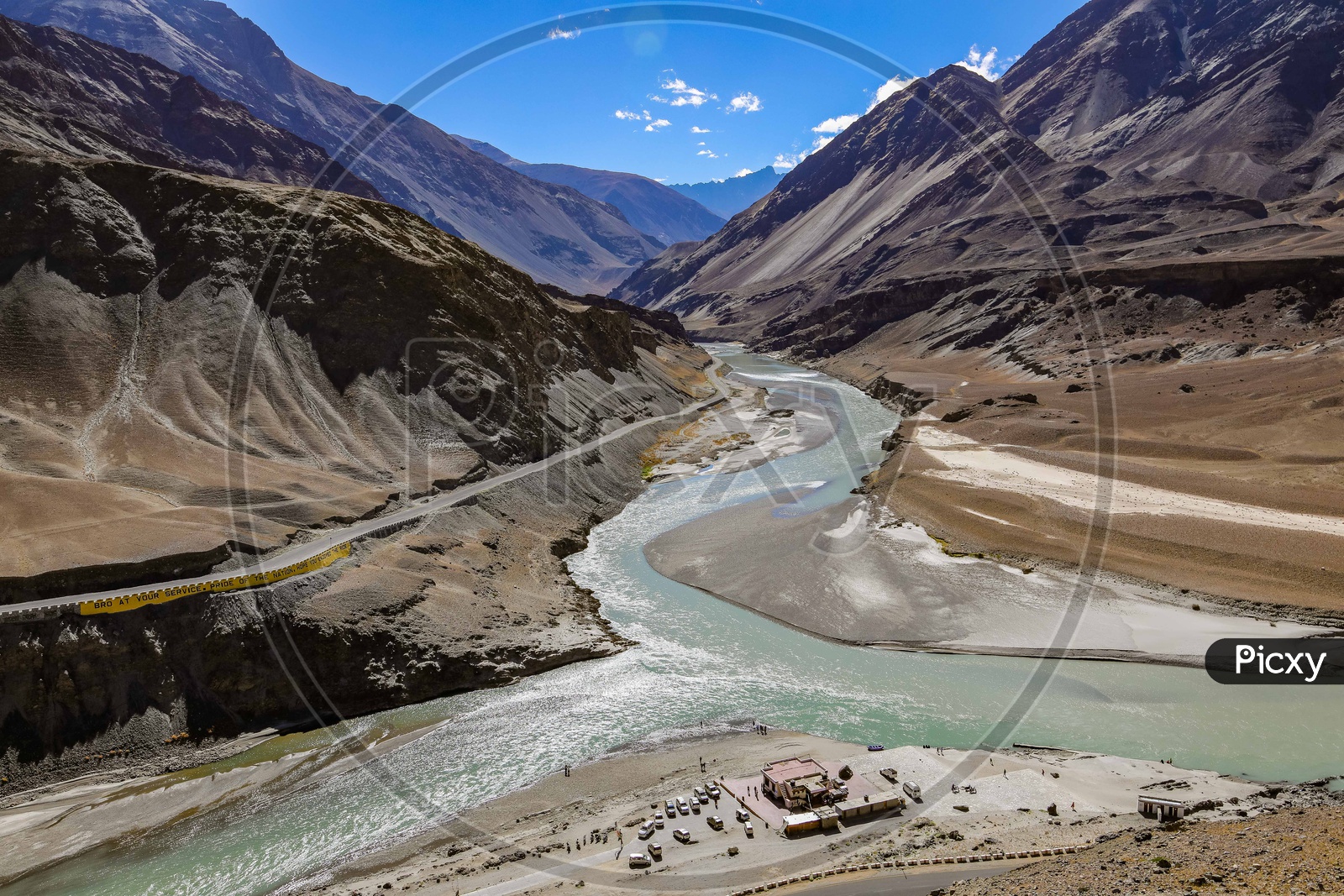 Indus river flowing in a valley amidst of mountains