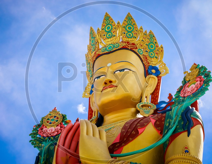 Face of the Giant Maitreya Statue with blue sky